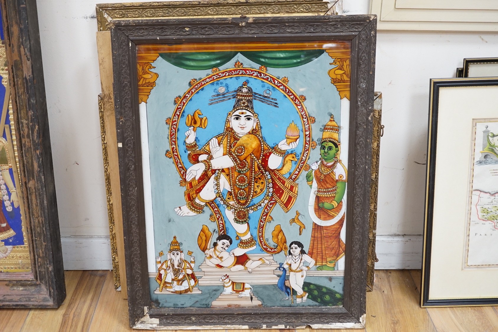 Indian School, eight assorted reverse paintings on glass, Studies of nobles, deities and other figures, largest 60 x 44cm